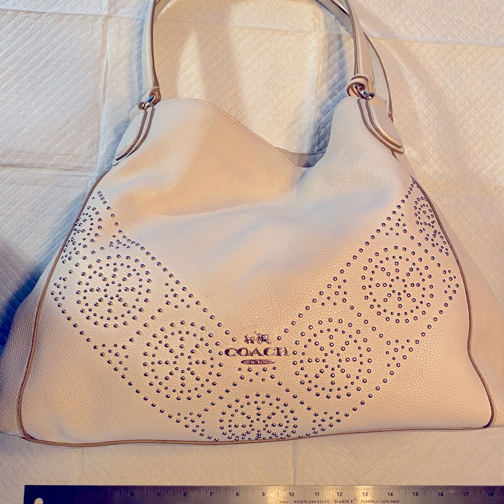 Chalk White large Coach purse with mostly yellow gold accents.